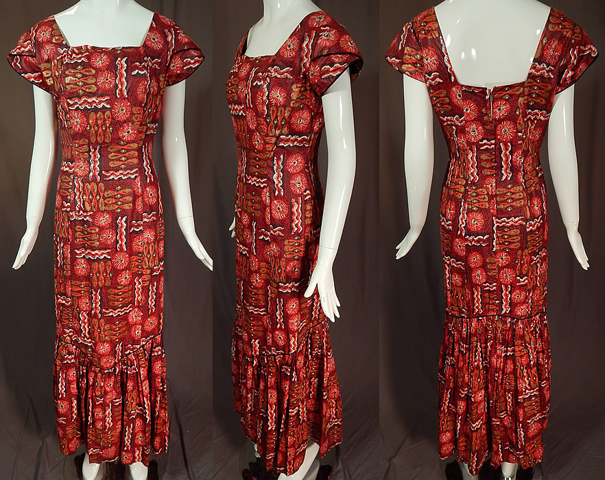 Vintage Kaulana By Perry Hawaiian Polynesian Print Red Cotton MuuMuu Maxi Dress
This vintage Kaulana by Perry Hawaii Polynesian print red cotton muumuu maxi dress dates from the 1950s. It is made of a dark red, gold metallic, black and white Polynesian inspired print polished sheen cotton fabric. 