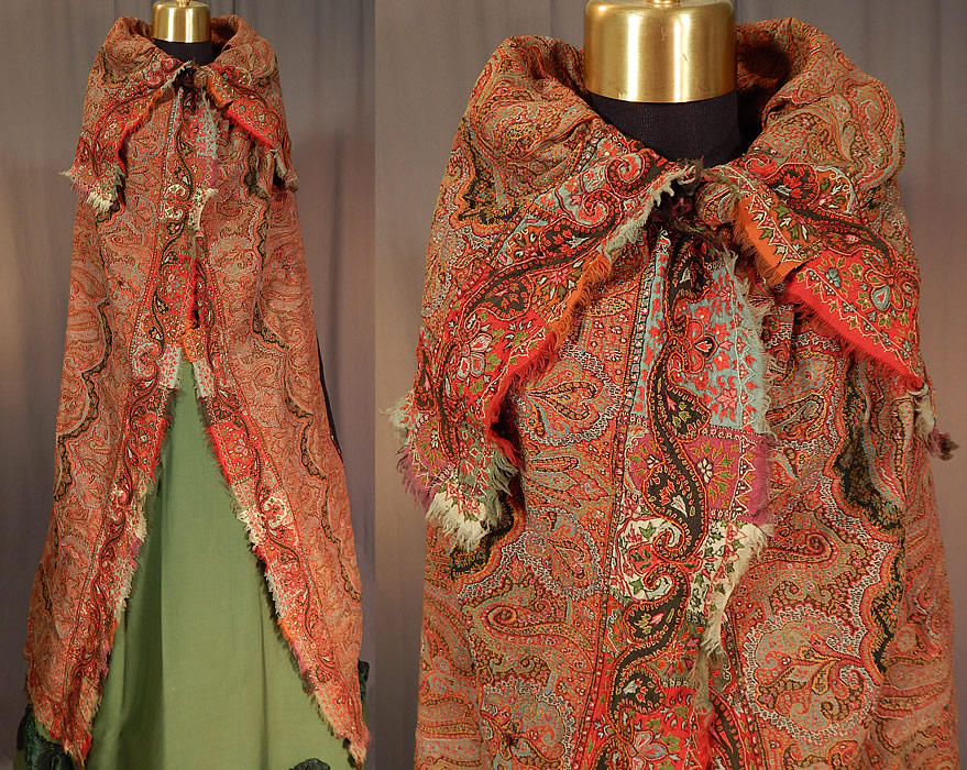 Victorian Antique Wool Signed Kashmir Paisley Shawl Collar Cloak Cape
This stunning shawl was created into a long floor length winter cloak cape, with a large shawl collar folded over the shoulders, paisley button closures on the front neck and is unlined.