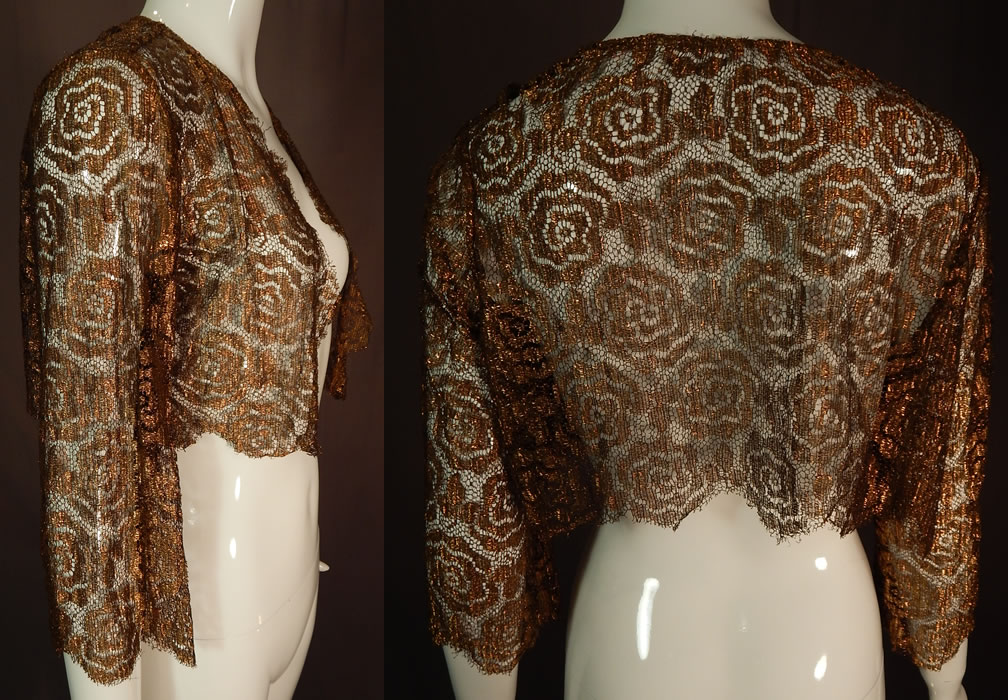 Vintage Art Deco Gold Metallic Lamé Lame Lace Crop Top Bolero Jacket Shrug
This Art Deco vintage gold metallic lamé lace crop top bolero jacket shrug dates from the 1930s. It is made of a sheer gold metallic thread lamé lace net woven spiral abstract floral leaf design pattern fabric.