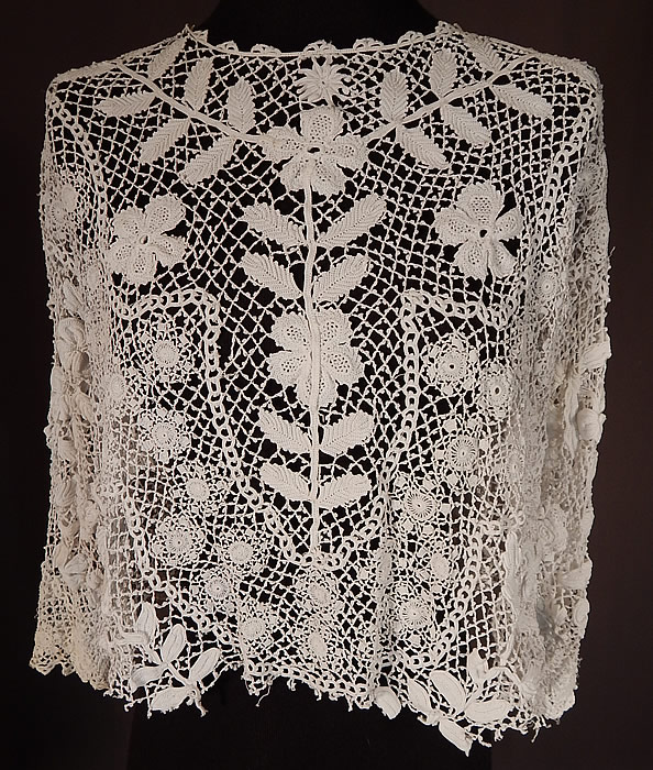 Edwardian Antique White Floral Meshwork Irish Crochet Lace Blouse
This Edwardian era antique white floral meshwork Irish crochet lace blouse dates from 1910. It is made of a white handmade Irish crochet lace with a dense heavily created detailed meshwork, raised three dimensional flowers, leaves and connecting thread picot ornamented bars
