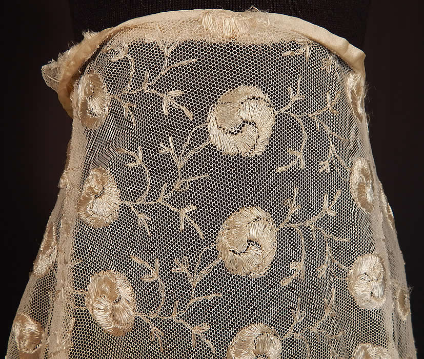 Vintage Yin & Yang Spiral Floral Vine Leaf Cream Tambour Embroidery Net Lace Skirt
It is made of an off white cream color sheer tulle net fabric, with silk tambour embroidery work done in a yin and yang symbol style floral vine leaf design. This lovely lace skirt is a long tea length, with hook closures on the back and is sheer, unlined.