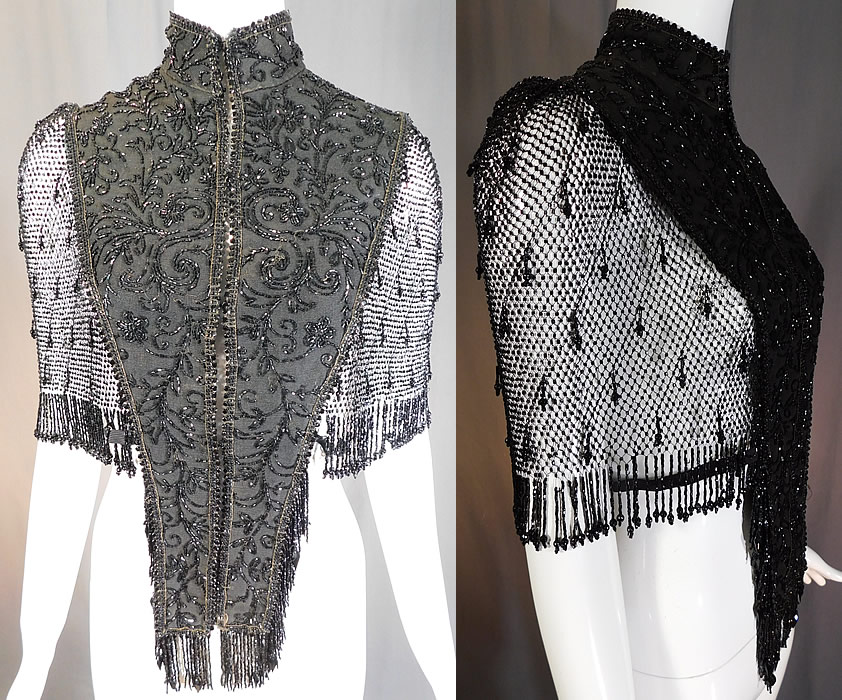 Victorian Black Silk Jet Beaded Fringe Mesh Mantle Dolman Pelerine Cloak Cape
It is made of a black silk grosgrain ribbed textured fabric with jet beaded floral vine leaf scrolling spiral designs and beading strung on a sheer mesh netting with beaded fringe along the sides and shoulders. 