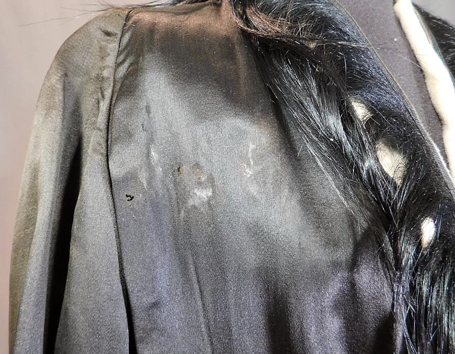 Vintage Art Deco Black Silk Fur Trim Flapper Cocoon Opera Coat Evening Jacket
It is in good as-is condition, has not been cleaned, is missing the original silk lining, some fraying on the remaining silk lining the sleeves, a few tiny moth holes, stains on the bottom back hem and front shoulder (see close-ups).