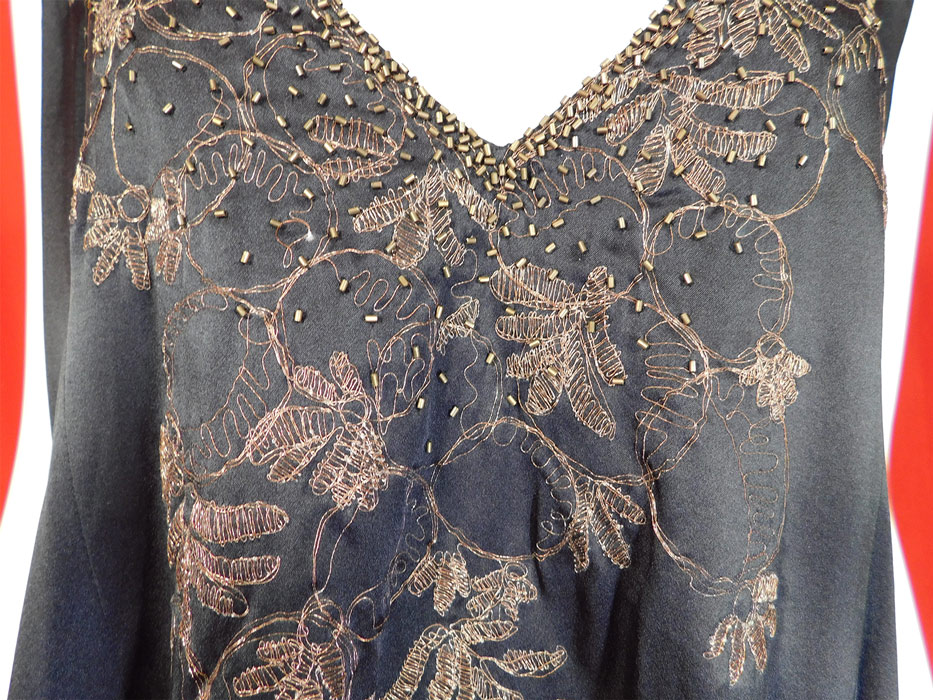 Vintage Art Deco Black Silk Gold Beaded Lame Embroidered Flapper Dress
This vintage amazing Art Deco black silk gold beaded lame embroidered flapper dress dates from the 1920s.