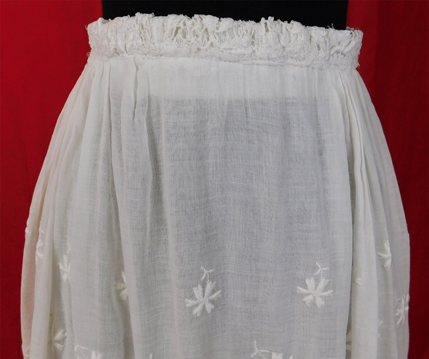 Edwardian Embroidered White Cotton Batiste Lace Layered Tea Length Skirt
This vintage Titanic Edwardian era embroidered white cotton batiste lace layered tea length skirt dates from 1912. It is made of a sheer white cotton batiste fabric with white raised padded satin stitch embroidery work flower, leaf designs and floral pattern lace.