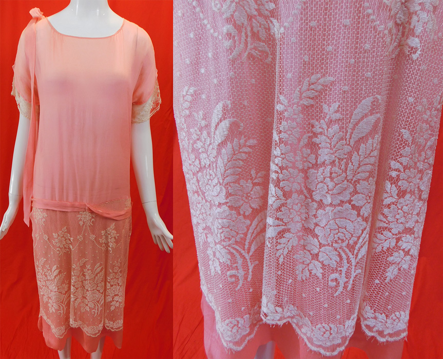 Vintage Pastel Pink Silk White Net Lace Overlay Skirt Belted Drop Waist Dress
This pretty pink dress has a loose fitting drop waist shift style with an attached belted back tie sash, short sleeves, silk ribbon bow trim hanging down from one shoulder and is sheer, unlined. 