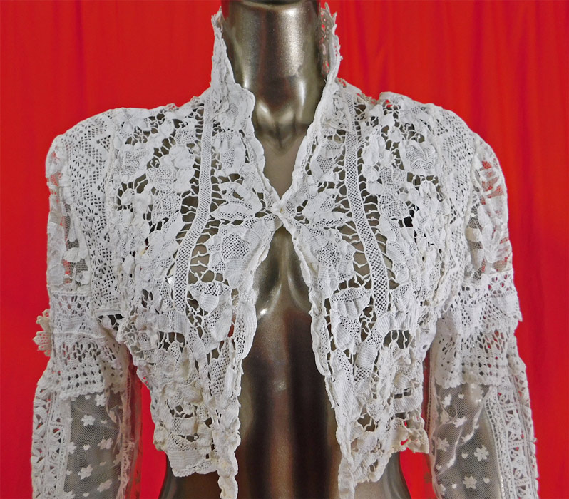 Vintage Victorian Style Point de Venise Needle Lace White Patchwork Short Bolero Jacket 
The jacket measures 15 inches long, with a 40 inch chest, 25 inch long sleeves and a 17 inch back.