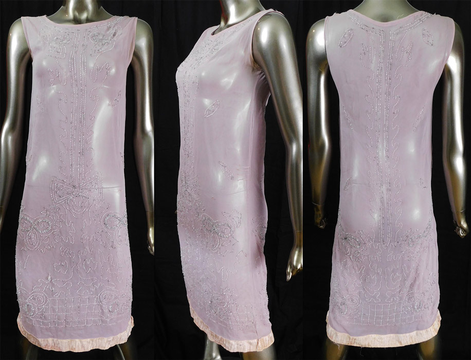 Vintage Art Deco Lilac Pink Sheer Silk Chiffon Crystal Beaded Flapper Dress
This lovely lilac flapper dress has a straight loose fitting shift style, sleeveless, with pink pleated gathering voided velvet devore fabric trim edging along the bottom hem and is sheer, unlined