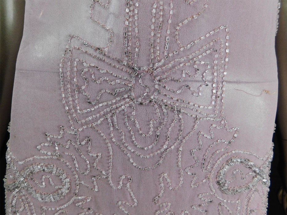 Vintage Art Deco Lilac Pink Sheer Silk Chiffon Crystal Beaded Flapper Dress
It is made of a pale purple pink lilac color sheer silk chiffon fabric, with crystal beaded decorative designs. 