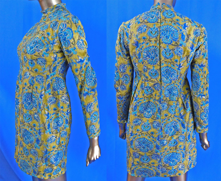 Vintage Chinese Kingfisher Blue Bird Feather Fabric Silk Shantung Mini Dress
This elaborate Chinese fabric cocktail dress has a mini dress short skirt style, with Mandarin collar, long tapered sleeves, a high empire waist, back zipper closure and is fully lined in a green nylon fabric inside.