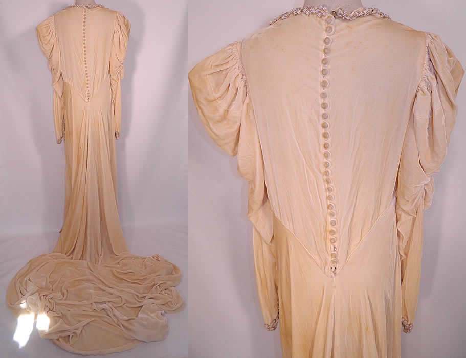 Vintage Pearl Beaded Cream Silk Velvet Bias Cut  Wedding Gown Dress Long Train Skirt. It is in good condition, but has not been cleaned, with faint age spotting stains and a few small holes scattered, two buttons are missing off the back.