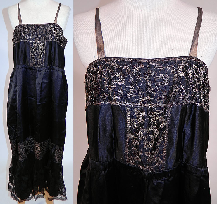 Vintage Art Deco Black Silk Gold Lame Lace Trim Flapper Slip Dress Lamé
This vintage Art Deco black silk gold lamé lace trim flapper slip dress dates from the 1920s. It is made of a black silk fabric, with gold lamé metallic lace trim, black silk bow accents and a black net silk appliques bottom ruffle skirt. This fabulous flapper slip dress has lamé shoulder straps, a gathered cinched waist, gathering around the bottom skirt above the ruffle flounce, back snap closures and is unlined.