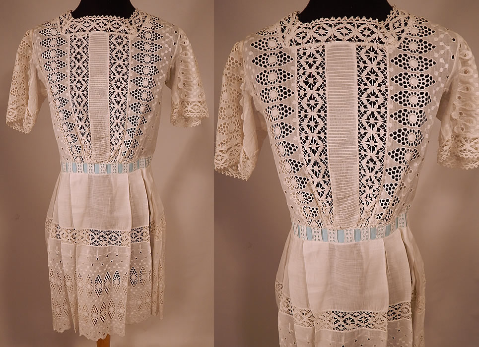Victorian White Cotton Broderie Anglaise Eyelet Embroidery Cutwork Lace Girls Dress
This antique Victorian era white cotton broderie anglaise eyelet embroidery cutwork lace girls dress dates from 1900. It is made of a sheer white cotton batiste fabric, with a broderie anglaise eyelet embroidery cutwork whitework lace and blue silk ribbon bow trim woven through the waist.