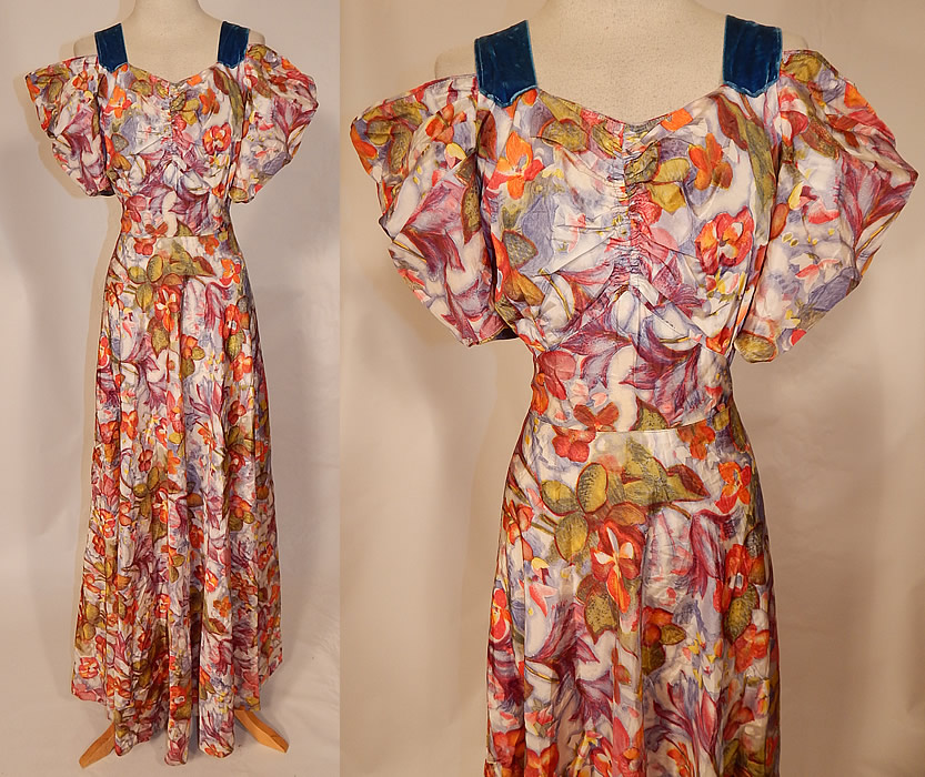 Vintage Orange Blossom Floral Pastel Print Rayon Taffeta Off Shoulder Dress Gown
This vintage orange blossom floral pastel print rayon taffeta off shoulder dress gown dates from the 1940s. It is made of a rayon taffeta fabric, with a colorful pastel print of orange blossom flowers and blue velvet ribbon trim on the top. This gorgeous gown has an off the shoulder style with blue velvet straps, full puffy sleeves, a gathered front sweetheart neckline, plunging V back with blue velvet ribbon trim, long floor length full skirt, side snap closures and is unlined. 