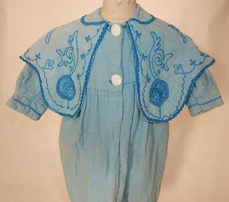 Edwardian Blue Embroidered Soutache Braided Trim Childs Winter Coat
This charming child's wonderful winter traveling coat has a loose fitting, long full style, with an embroidered sailor style shawl collar, long sleeves with fitted cuffs, 2 large mother of pearl buttons down the front for closure and is fully lined inside. 