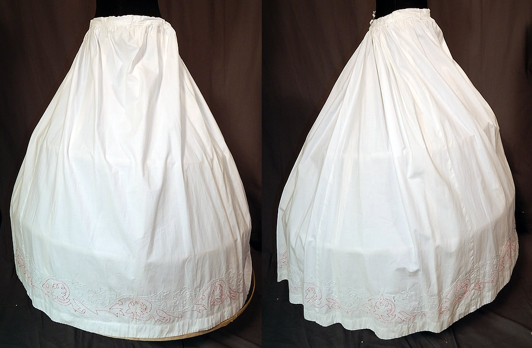 Victorian White Cotton Red Soutache Stitched Embroidery Full Petticoat Skirt
This antique Victorian Civil War era white cotton red soutache stitched embroidery full petticoat skirt dates from the 1860s. It is made of a crisp white cotton fabric, with red, white and blue gray accented decorative stitched soutache embroidery work along the bottom hem. 