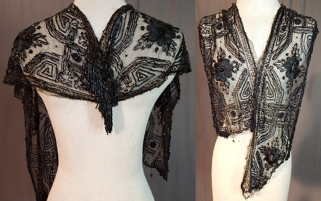 Edwardian Black Net Silk Embroidered Beaded Dress Trim Shawl Collar
This Edwardian Titanic era antique black net silk embroidered beaded dress trim shawl collar dates from 1912. It is made of a sheer black net with silk ribbon flowers, chain stitch embroidery work and black jet beading done in abstract geometric decorative designs. 