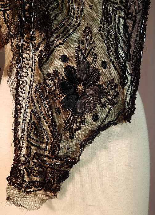 Edwardian Black Net Silk Embroidered Beaded Dress Trim Shawl Collar
The trim measures 55 inches long and 8 inches wide at the widest area. It is in good as-is condition, with some loose missing beads and frayed ends (see close-ups). This is truly a wonderful piece of wearable art which would be great for design or restoration!