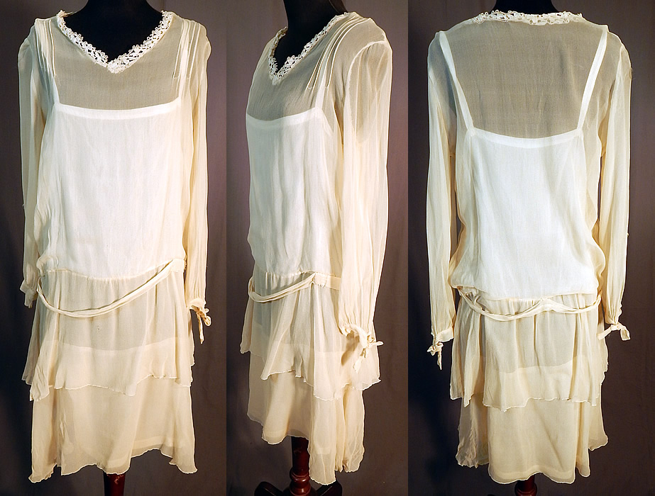 Vintage Cream Silk Chiffon Lace Trim Tiered Ruffle Skirt Drop Waist Dress
This vintage cream silk chiffon lace trim tiered skirt drop waist dress dates from the 1920s. It is made of an off white cream color sheer silk chiffon fabric, with cream lace trim around the neckline. 