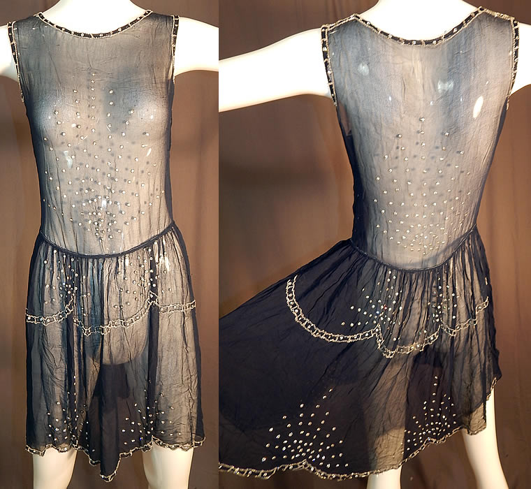 Vintage  Art Deco Navy Blue Sheer Silk Chiffon Rhinestone Beaded Flapper Dress
This vintage Art Deco navy blue sheer silk chiffon rhinestone beaded flapper dress dates from the 1920s. It is made of a navy blue sheer silk chiffon fabric with rhinestone, crystal beading.