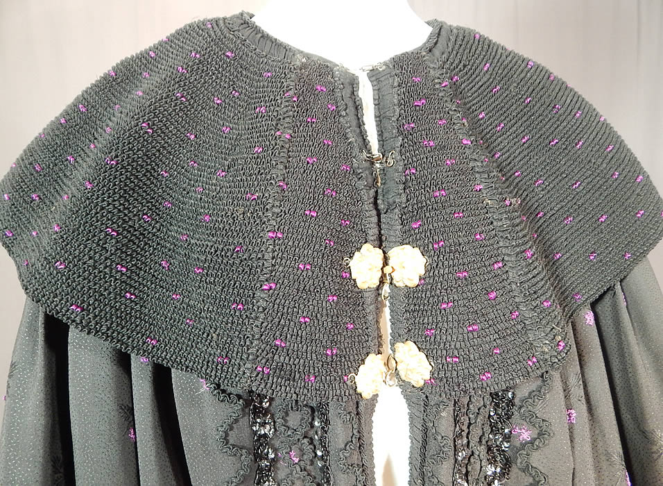 Victorian Purple Black Silk Damask Large Embroidered Shawl Collar Cloak Cape
It is made of a purple and black silk wool blend damask weave fabric with a woven floral, tiny fleck Swiss dot design pattern.