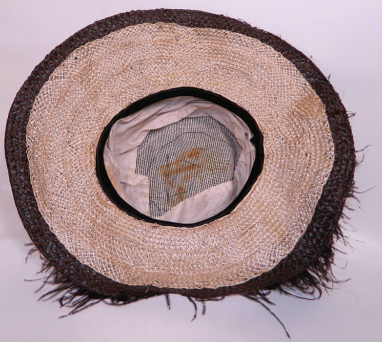 Edwardian Woven Black Straw Ostrich Feather Wide Brim Hat & Hatpins. It is in good condition, with some minor wear and slight soiling underneath. The inside crown has some remnants of white cotton lining.