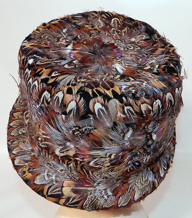 Vintage Womens Black Velvet Pheasant Feather Fedora Hat. It is fully lined inside in a black silk fabric. The hat measures 22 inches inside crown circumference. It is in good condition.