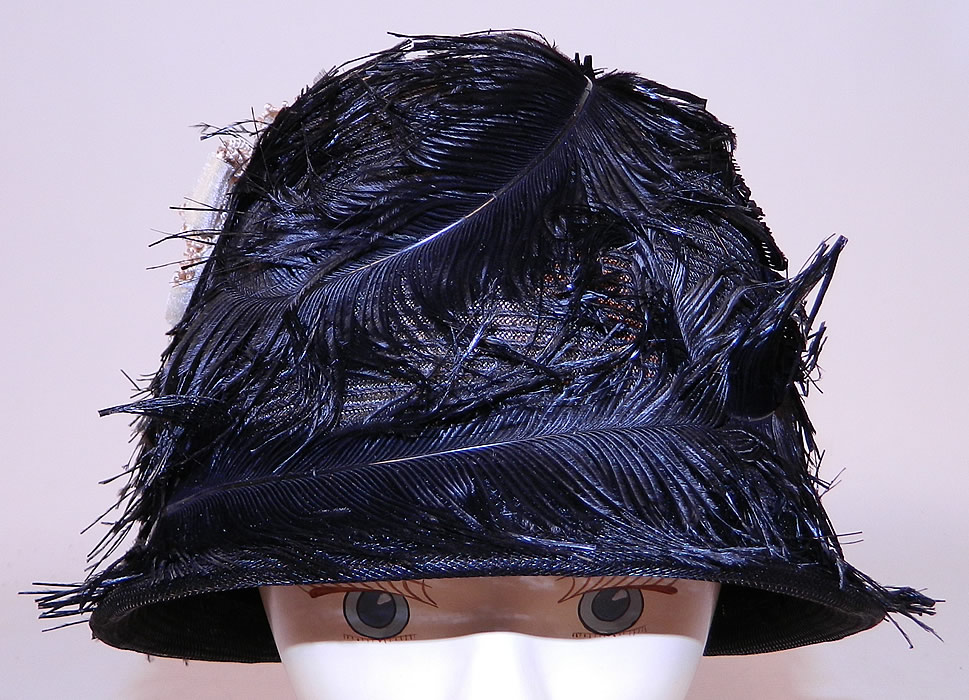 Vintage Black Feather Woven Horse Hair Straw Flapper Cloche Hat
The hat is made of a sheer woven black horse hair net straw covered with black feathers and a small cream velvet ribbon bow trim on the side.