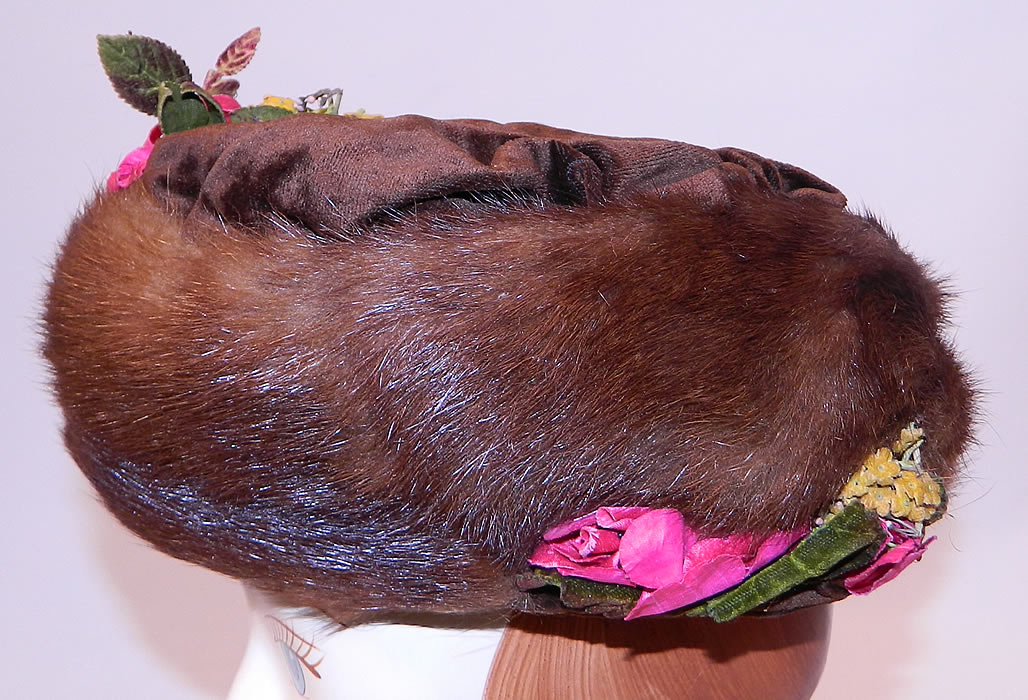 Titanic Edwardian Brown Velvet Mink Fur Floral Trim Toque Traveling Winter Hat
This wonderful winter brimless toque travel hat has a large rotund circular style and would have sat perched atop a Gibson Girl style up do hairdo secured with hat pins. 