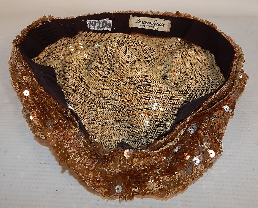 Vintage Frances Louise Hollywood Label Art Deco Gold Sequin Flapper Cloche Hat
The hat measures 23 inches inside circumference. It is in good condition, with only a few missing sequin which are barely noticeable. This is truly a wonderful piece of wearable Art Deco millinery art! 