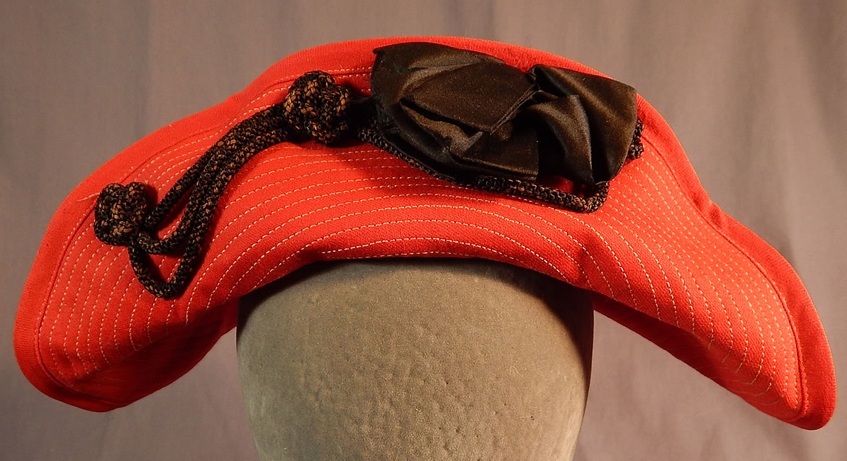 Vintage Victor Girls Red Wool White Stitched Black Bow Trim Bicorn Breton Hat
This vintage Victor girls red wool white stitched black bow trim bicorn Breton hat dates from the 1920s. 