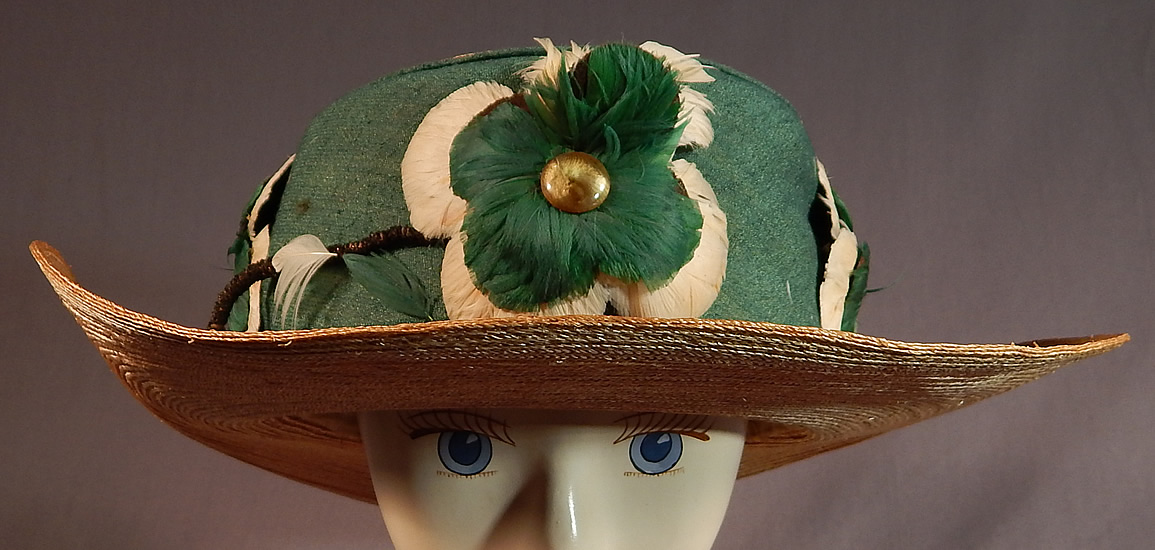 Vintage M. H. Loach Natural Woven Straw Green Ribbon Feather Rosette Wide Brim Hat
This sensational summer sun hat has slightly upturned sides, wide brim with rounded crown top and is fully lined, in a white silk fabric inside. 