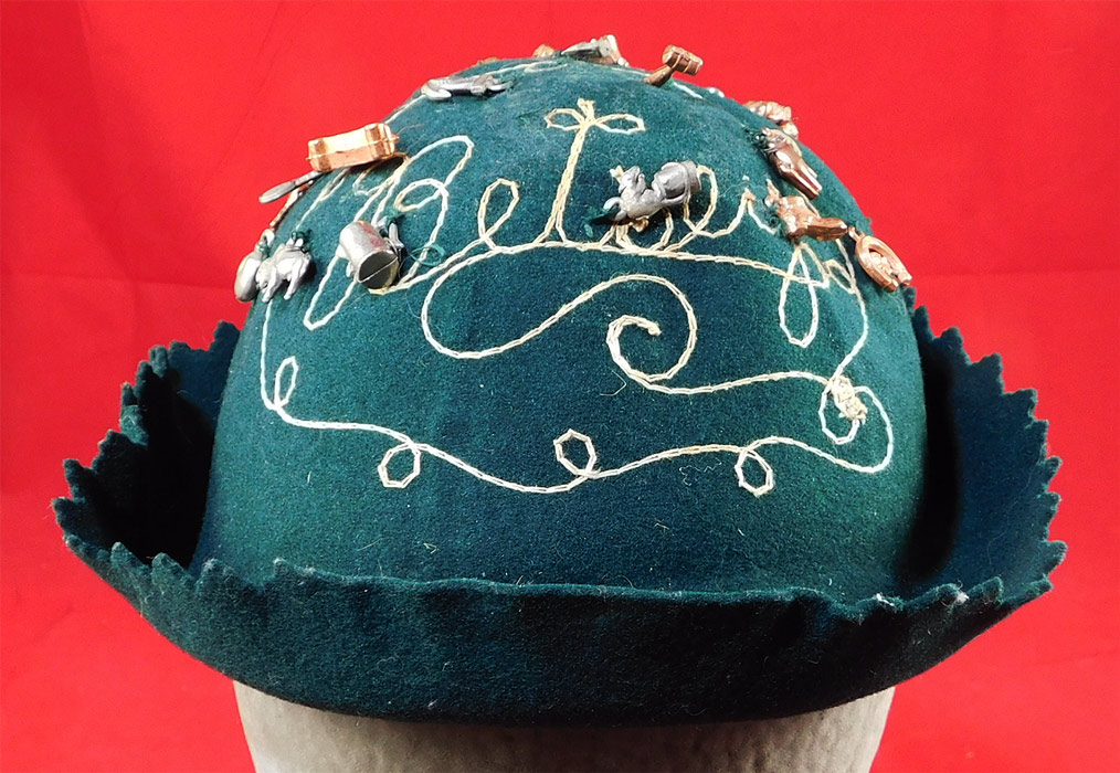 Vintage Cracker Jack Prize Toy Charms Green Felt Beanie Whoopee Cap Jughead Hat
It is made of a green wool felt fabric, with silver and copper color metal charms sewn onto it. 