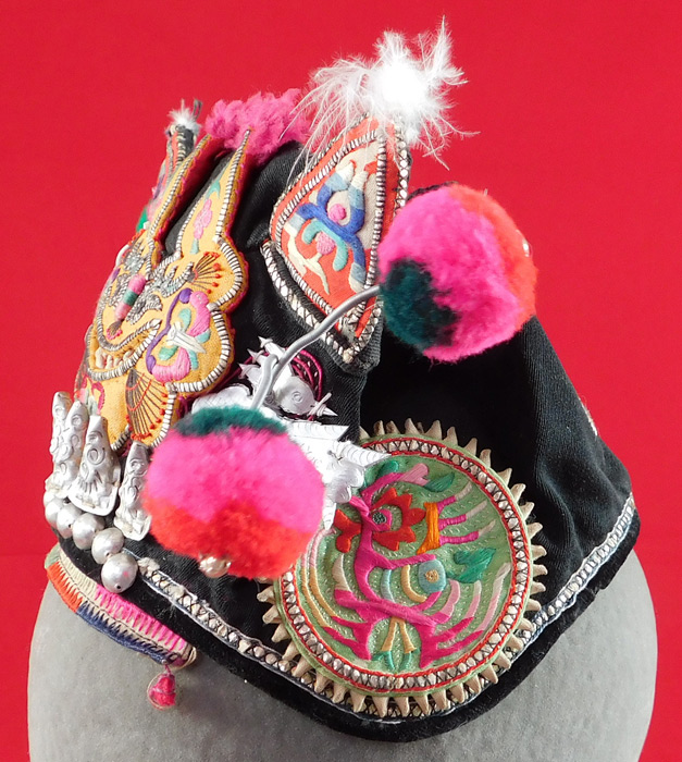 Antique Chinese Bai Miao Minority Childrens Festival Embroidered Tiger Wind Hat
These Bai Miao Minority Chinese children's ethnic hats were worn at festivals and designed to provide protection from evil spirits, demons, and ghosts, but also to influence the wearing with important qualities such as wealth, health, courage, academic success, happiness, long life, grace and beauty.