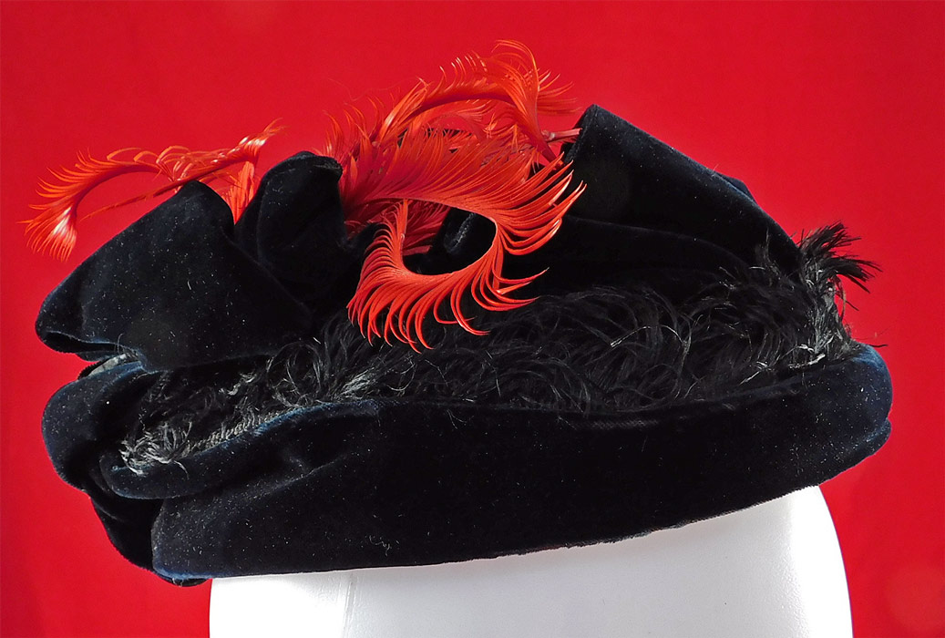 Victorian 1870s Black Velvet Red Feather Ribbon Trim Small Pork Pie Toque Traveling Hat
This beautiful black and red rare womens toque travel hat has a small petite brimless pork pie style with an oval shape, decorative trimmings piled on top and is fully lined in a brown polished cotton fabric inside. 
