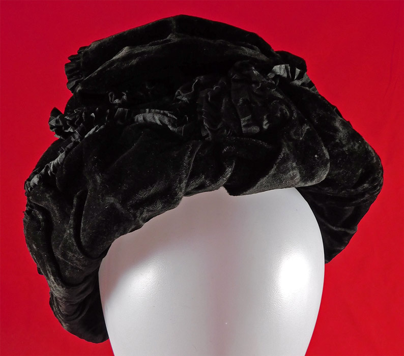 Victorian Black Velvet Silk Ruched Pleated Trim Mourning Bonnet Winter Hat
This beautiful black velvet bonnet winter hat has a round shape with layered gathering velvet fabrics and is fully lined in a black silk fabric inside. 