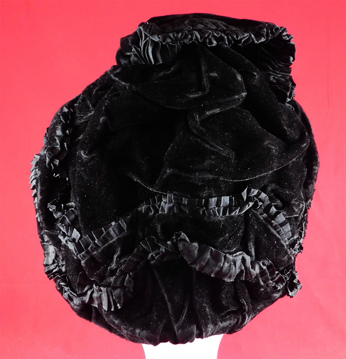 Victorian Black Velvet Silk Ruched Pleated Trim Mourning Bonnet Winter Hat
The bonnet measures 10 inches tall, 8 inches wide across, 4 inches deep and is 24 inches in circumference. 