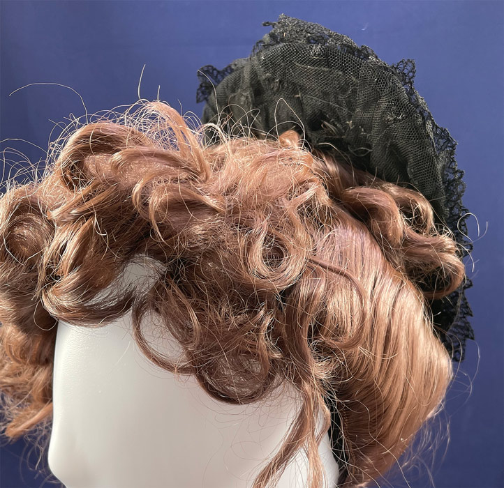 Victorian Antique Black Chantilly Tambour Lace Net Wire Frame Morning Bonnet Hat
This marvelous mourning morning bonnet style headdress hat has a wider top front brim with a wired lace ruffle gathered trim accent, lace ruffle trim edging, no tie straps to secure would have been held in place with hat pins and is lined in a black net with remnants of a paper label inside from the Rochester Historical Society (deaccession).