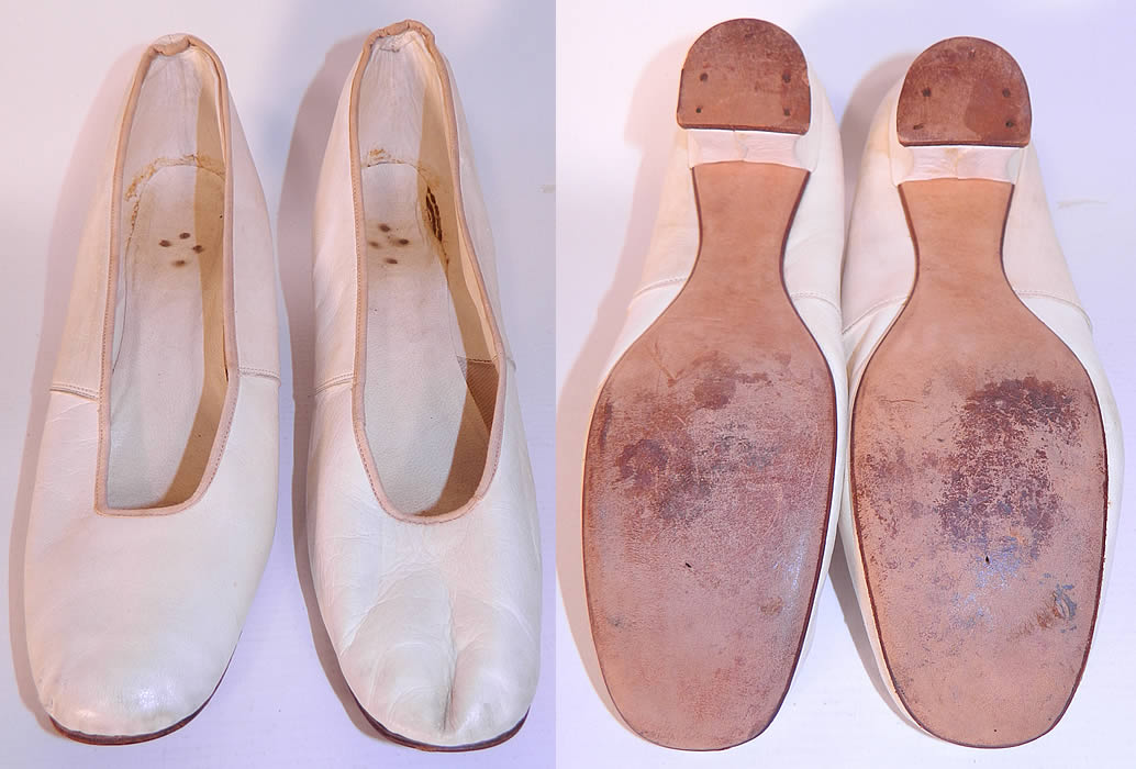 Victorian White Kid Leather Small Bridal Wedding Slippers Shoes Straight Sole. They are lined inside in white kid leather. The shoes are a small size measure 9 inches long and 2 1/4 inches wide.