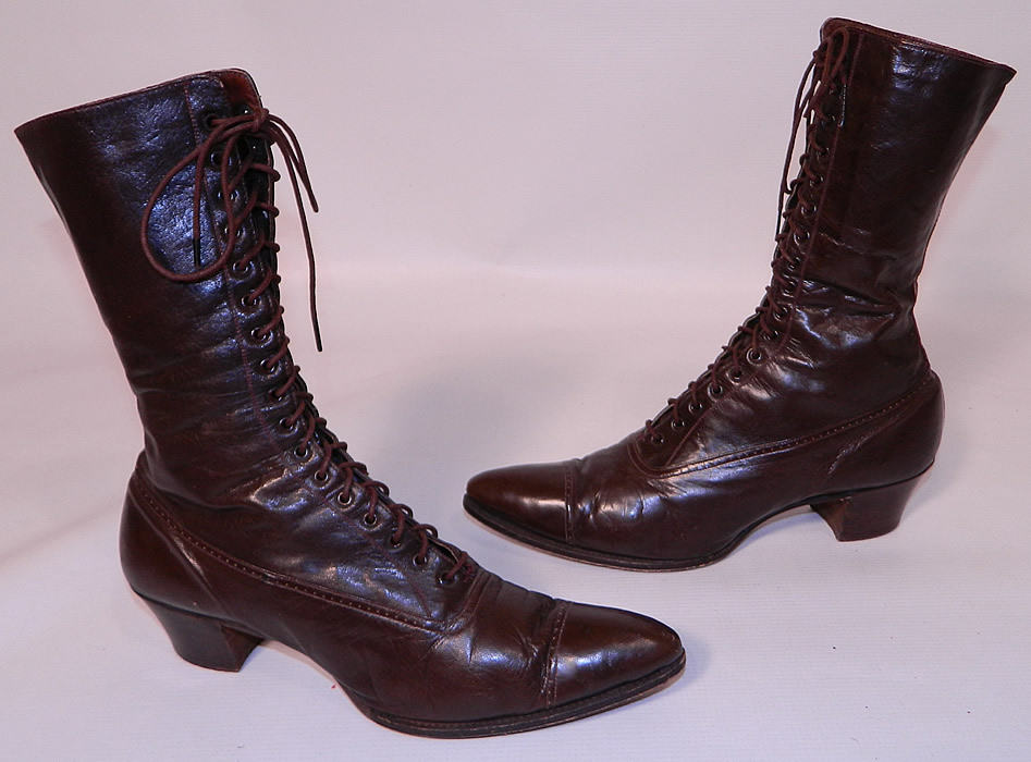 Victorian Antique Brown Leather High Top Lace-up Boots. These beautiful boots have the original brown shoe laces, pointed toes and stacked wooden cube heels. The boots measure 11 inches long, 2 1/2 inches wide, with 2 inch high heels. 