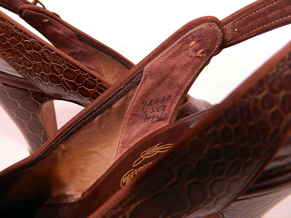 Vintage Laird Schober & Co Brown Leather Alligator Slingback Platform Shoes 
The shoes measure 9 1/2 inches long, 3 inches wide, with 3 inch high heels and are stamped inside a size 7 AAAA