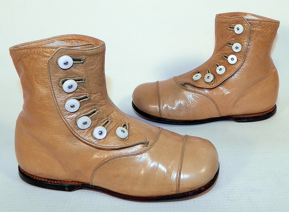 Unworn Victorian Tan Leather High Button Baby Boots Infant Childs Shoes
This pair of antique Victorian era unworn tan leather high button baby boots infant child's shoes date from 1900.  These charming child's high top button baby boots appear to have never been worn and are in excellent condition. They are truly a wonderful piece of quality made wearable shoe art!
