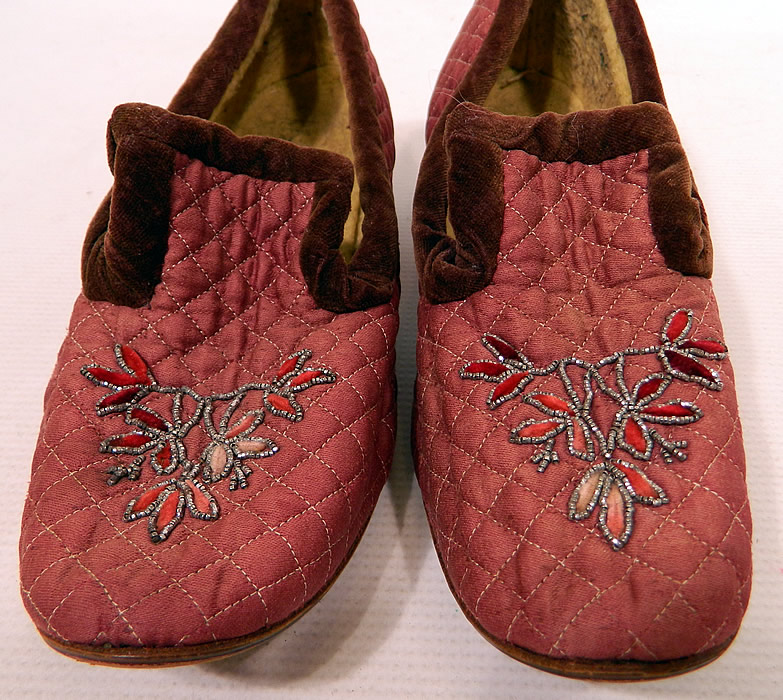 Victorian Burgundy Quilted Silk Steel Cut Beaded Velvet Trim Slipper Shoes
These charming cozy warm winter slip-on slipper style house shoes have long front tongues, squared toes, with hard leather soles stamped with a 4 on the bottom, stacked wooden low French Louis XV heels and are lined in a flannel fleece fabric. 