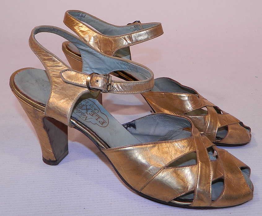 Vintage Nisley Flexray Art Deco Gold Leather Ankle Strap Evening Dance Shoes
These elegant evening dance shoes have decorative lattice work open straps criss-crossing on the front instep vamps, adjustable ankle straps with gold buckle closures and gold leather covered modified boulevard high heels. 
