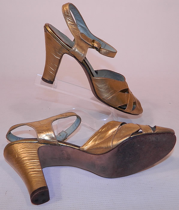 Vintage Nisley Flexray Art Deco Gold Leather Ankle Strap Evening Dance Shoes
The shoes measure 9 1/2 inches long, 2 1/2 inches wide, with 3 inch high heels and are stamped inside a size 7. They are in good condition and have been gently worn, with some scuff marks wear on the gold leather. These are truly a wonderful piece of wearable Art Deco shoe art!