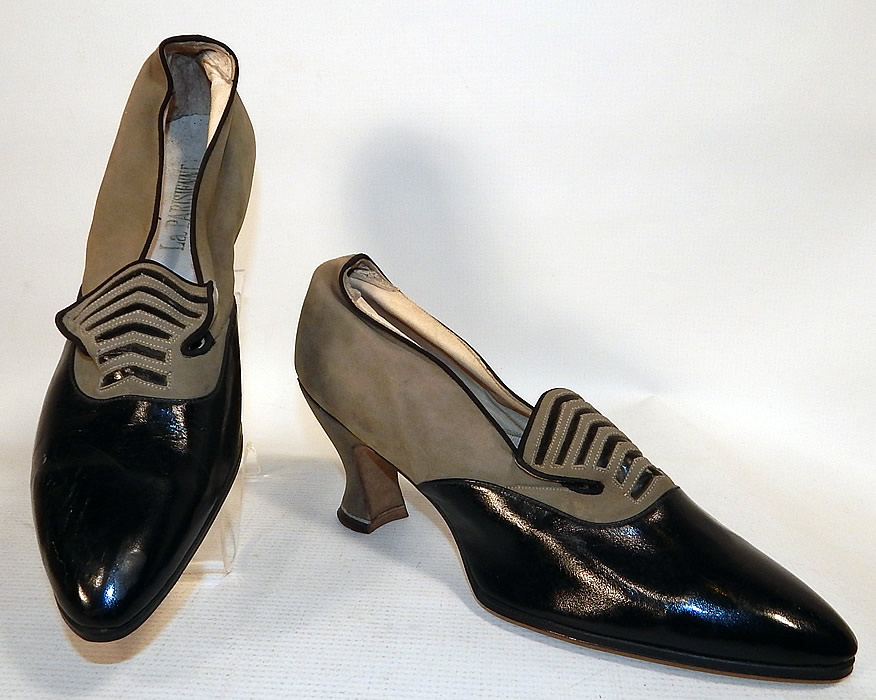 Vintage La Parisienne France Art Deco Gray Suede Black Leather Flapper Shoes
These fabulous flapper shoes have a two tone contrasting color combination, with a slip on slipper style, pointed toes and gray suede covered Louis XV French spool heels. 