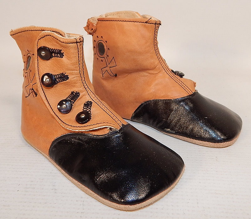 Victorian Peters Sweetheart Tan & Black Leather High Button Baby Boots Childs Shoes
These charming child's high top button baby boots have squared toes, with 4 black shoe buttons down the sides for closure and soft suede leather bottom soles.