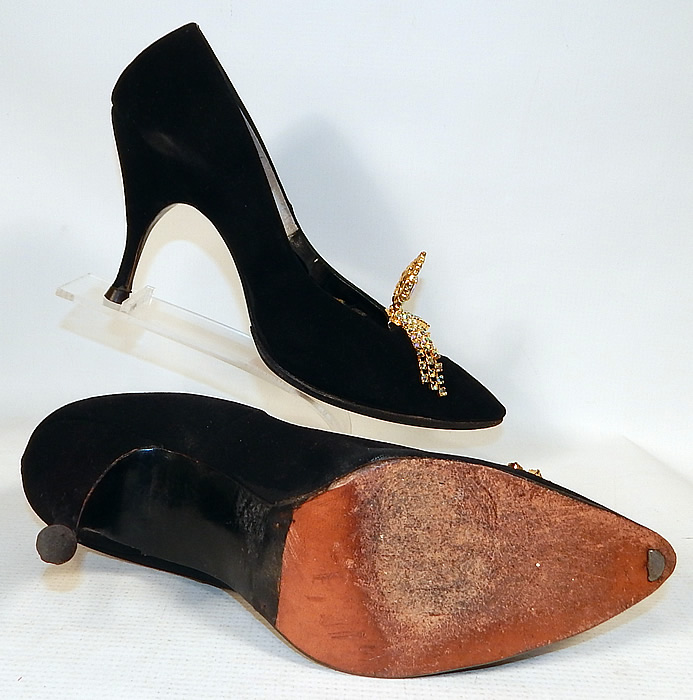 Vintage Vogue House Black Suede Leather Stiletto Heel Pumps Rhinestone Shoe Buckles
These elegant evening pump shoes have a slip on style, pointed toes, a stiletto high heel and "Vogue House" label stamped inside the insoles. 
