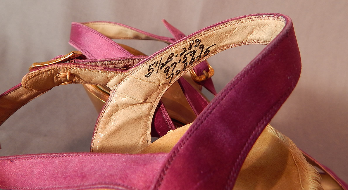 Vintage Purple Silk Satin Ankle Strap Gold Leather Heel Trim Platform Shoes
The shoes measure 9 inches long, 2 1/2 inches wide, with 3 1/2 inch high heels and are stamped inside size 5 1/2 B. 