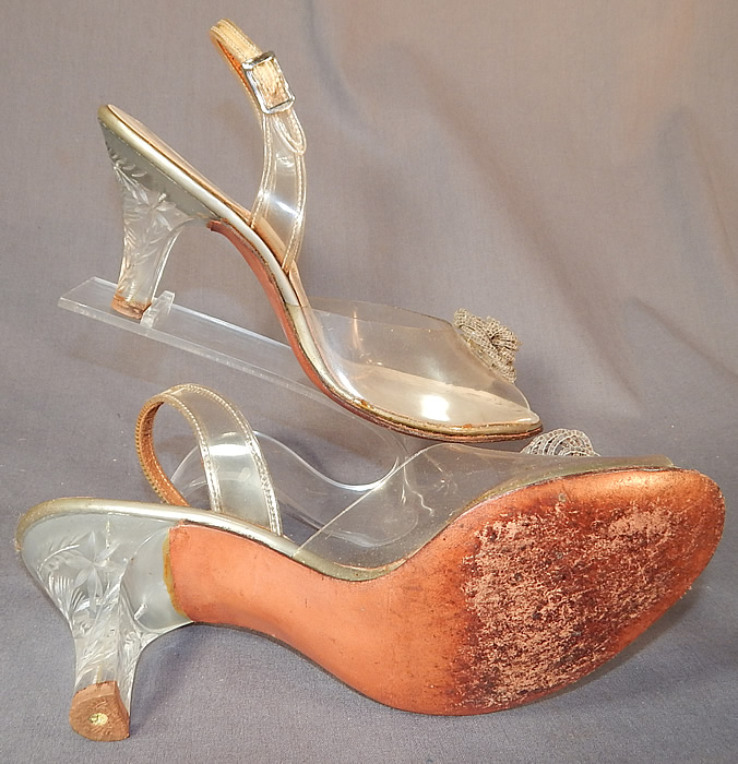 Vintage Foot Flairs Beaded Clear Carved Lucite High Heels Slingback Shoes
The shoes measure 9 1/2 inches long, 3 inches wide, with 2 1/2 inch high heels. They have been gently worn, with some minor wear. These are truly a wonderful piece of quality made wearable shoe art!